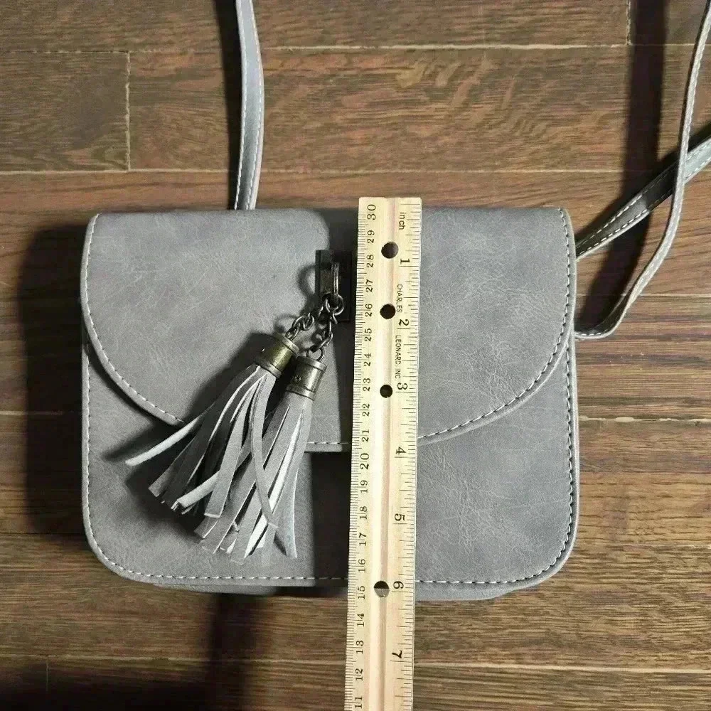 Grey crossbody boho festival bag with tassels from J francis